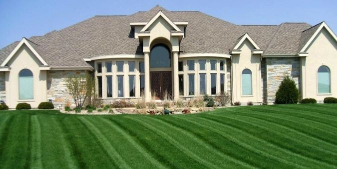 Luxury residential home with manicured lawn